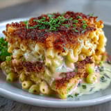Rich and cheesy macaroni bake featuring sharp cheddar and Gruyère, topped with buttery breadcrumbs for extra crunch.  